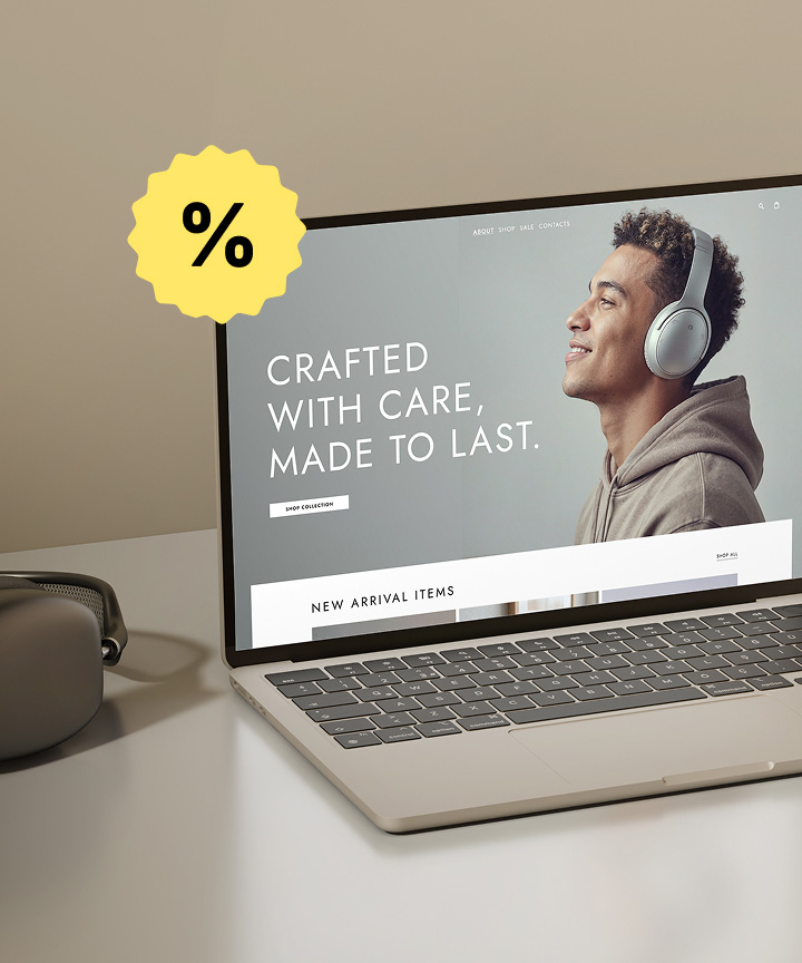 Laptop mockup displaying an e-commerce website with the text “CRAFTED WITH CARE, MADE TO LAST” and a man wearing headphones. A yellow percentage sticker overlaps the top left corner of the screen.